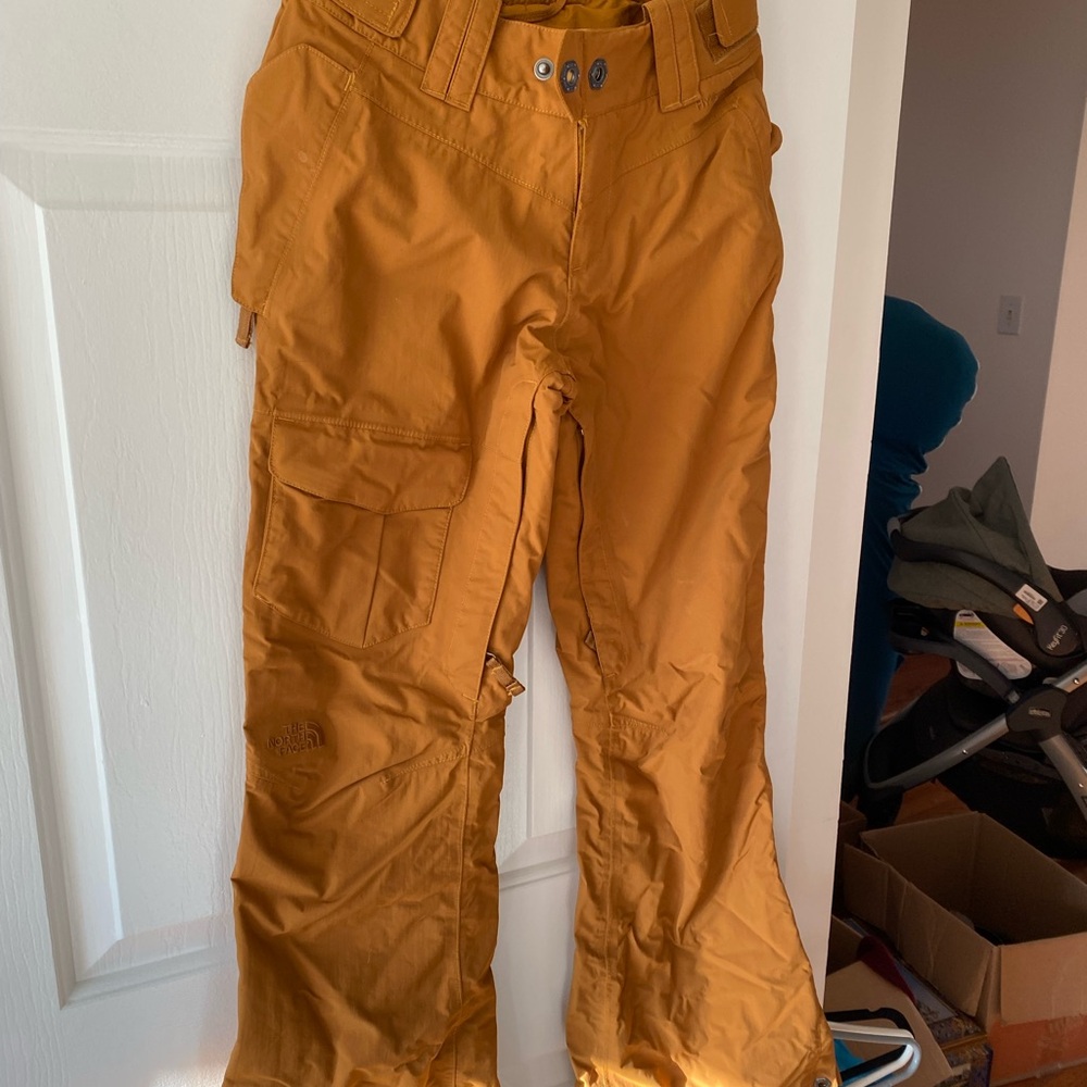 The North Face women’s ski/snowboard pants in burnt yellow/brown